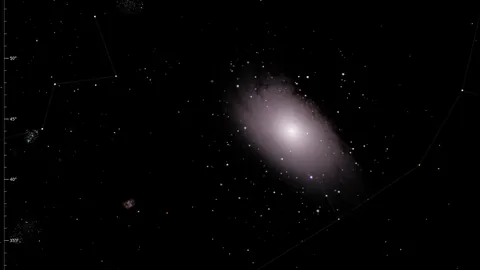 A real photograph of the Andromeda Galaxy shown in place in the Night Atlas sky, surrounded by stars, with the menu on the right.